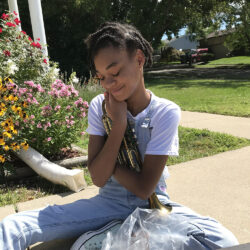 a girl holding a trumpet